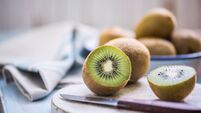 kiwi halves on wooden board