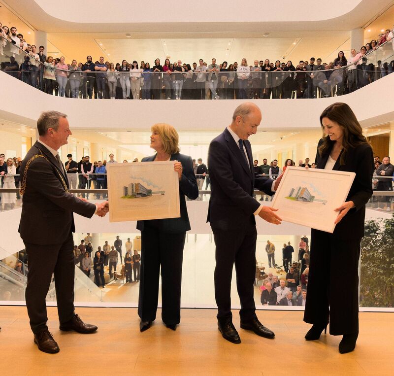 Cathy Kearney and Kristina Raspe, Apple’s vice president of places, present Mr Martin and Mr Dennehy with gifts to mark the opening of the Hollyhill building on Apple’s Cork campus.
