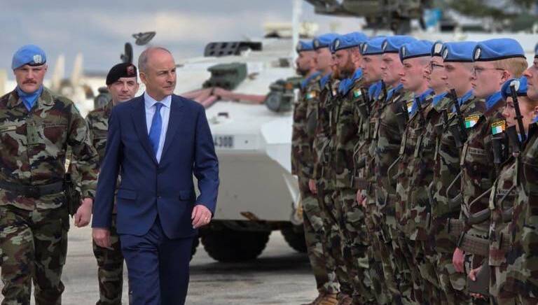 Taoiseach Micheál Martin visiting Camp Shamrock in Lebanon last December. A small country cannot outspend the great powers, but it can decide what kind of politics it wants to import, writes Colin Sheridan. File Picture: Irish Defence Forces
