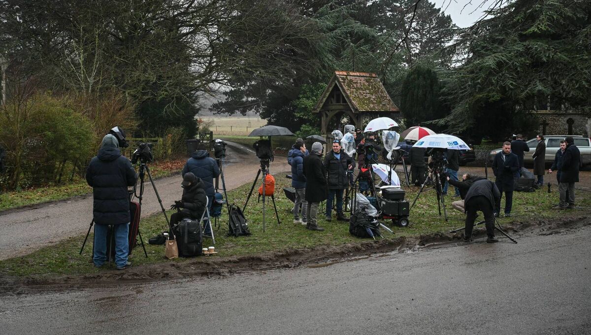 Members of the media are pictured camped out at an entrance to Wood Farm on the royal family's Sandringham Estate in Norfolk, England, on  Thursday where former prince Andrew was arrested earlier in the day. Picture: Justin Tallis / AFP via Getty