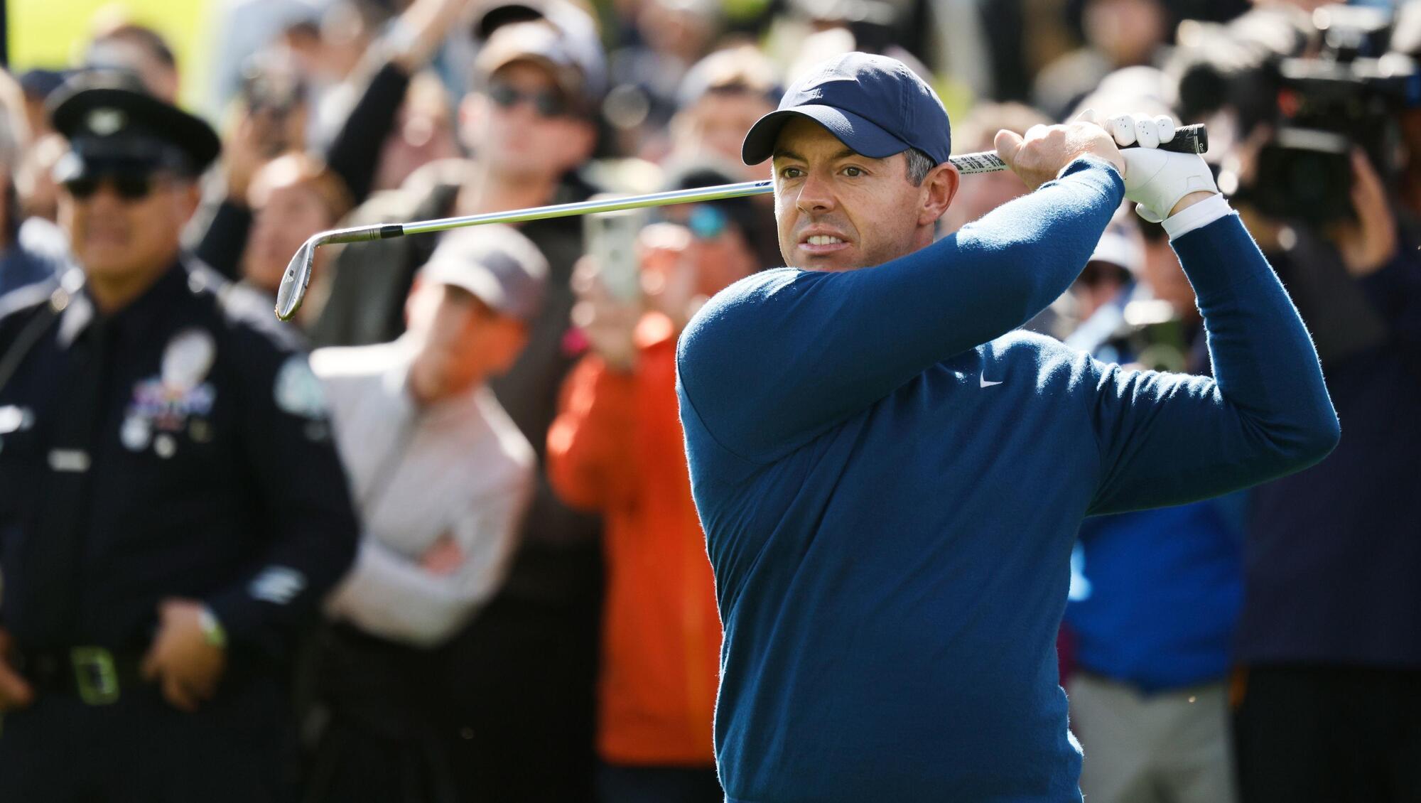 Rory McIlroy battles wild weather to claim share of the lead in Los Angeles