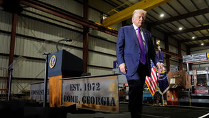 <p>US president Donald Trump said he may get Barack Obama ‘out of trouble’ by releasing UFO files (AP)</p>