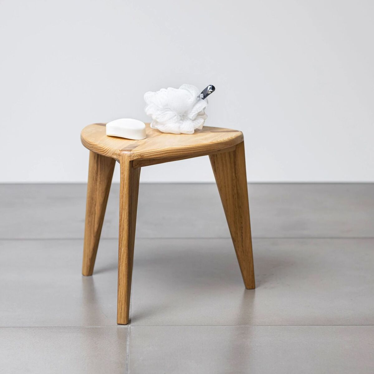 Three-legged shower stool in acacia, €219, Medaworkshop, Etsy. Three-legged shower stool in acacia, €219, Medaworkshop, Etsy.