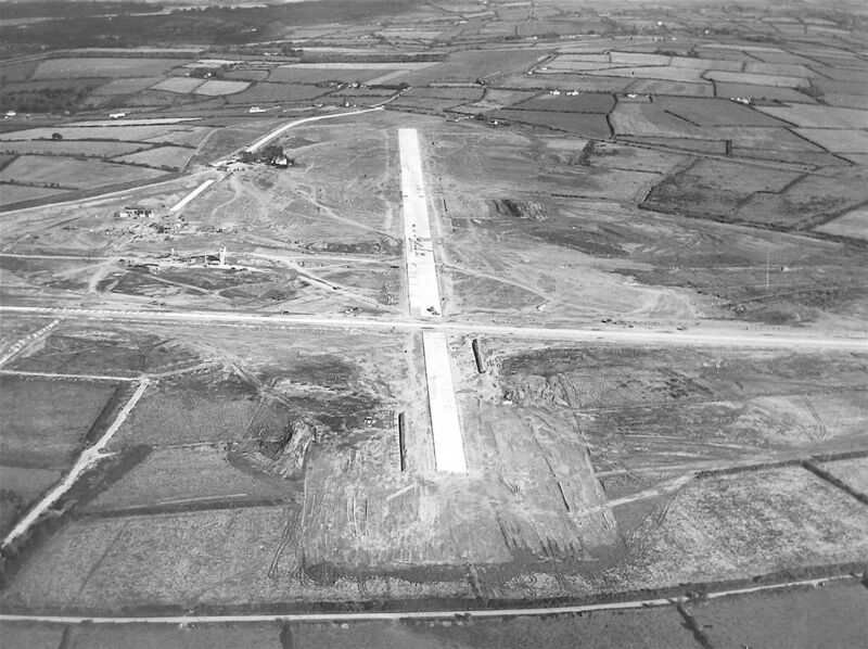 The two runways and terminal buildings under construction in October 1960.
