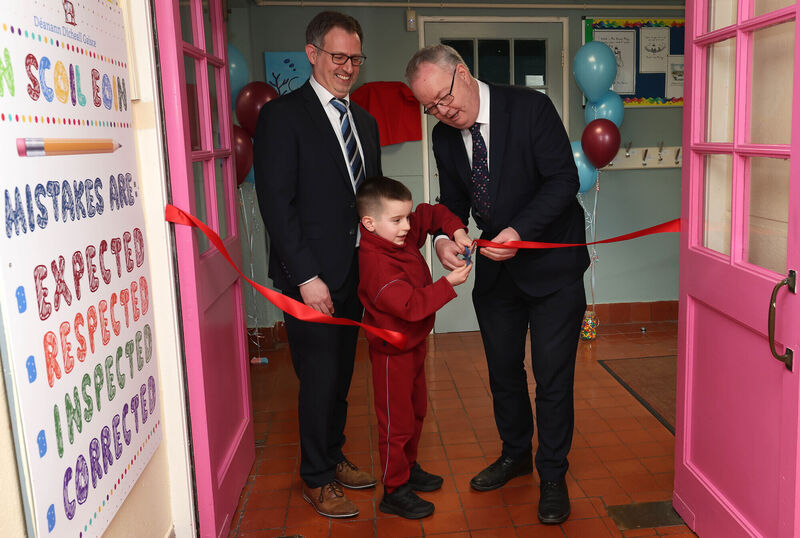 Scoil Eoin principal William Casey; Keelan Crowley Kelleher, junior infants, and minister Michael Moynihan at the opening of new sensory rooms funded by parents at Scoil Eoin. Picture: Jim Coughlan