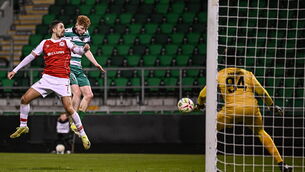 <p>Adam Brennan of Shamrock Rovers scores his side's second goal, despite pressure from St Patrick's Athletic's Zack Elbouzedi. Pic: Seb Daly/Sportsfile</p>