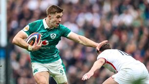 <p>HAND OFF: Ireland's Jack Crowley fends off the George Ford tackle at Twickenham. Pic: Billy Stickland, Inpho</p>
