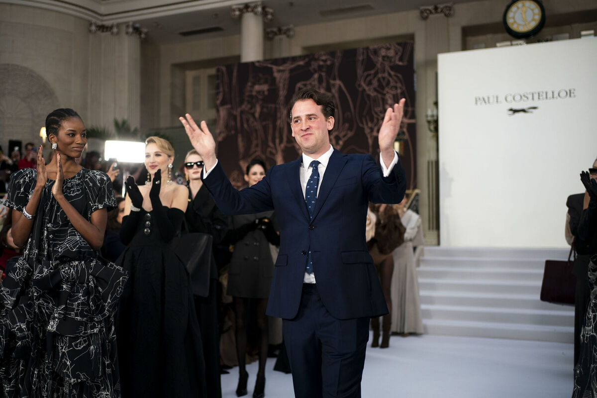 William Costelloe, creative director of Paul Costelloe, acknowledging the applause of the London Fashion Week attendees at his runway show at the Palm Court at The Waldorf Aldwych. Picture: Ben Whitley/PA