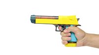Toy gun in hand on a white background, isolate.