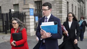 <p>The judge also made a production order for jailed teacher Enoch Burke (centre) to join the proceedings against his his mother Martina Burke (left) and his sister Ammi Burke (right) on Wednesday by videolink. File picture</p>