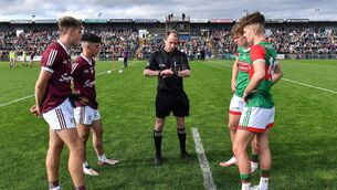 <p>Referee Niall Cullen with Galway joint-captains Jack Lonergan, left, and Éanna Monaghan and Mayo joint-captains Diarmuid Duffy and Ronan Clarke, right, before the 2022 Electric Ireland GAA Football All-Ireland Minor Championship Final match between Galway and Mayo at Dr Hyde Park in Roscommon. Photo by Piaras Ó Mídheach/Sportsfile</p>
