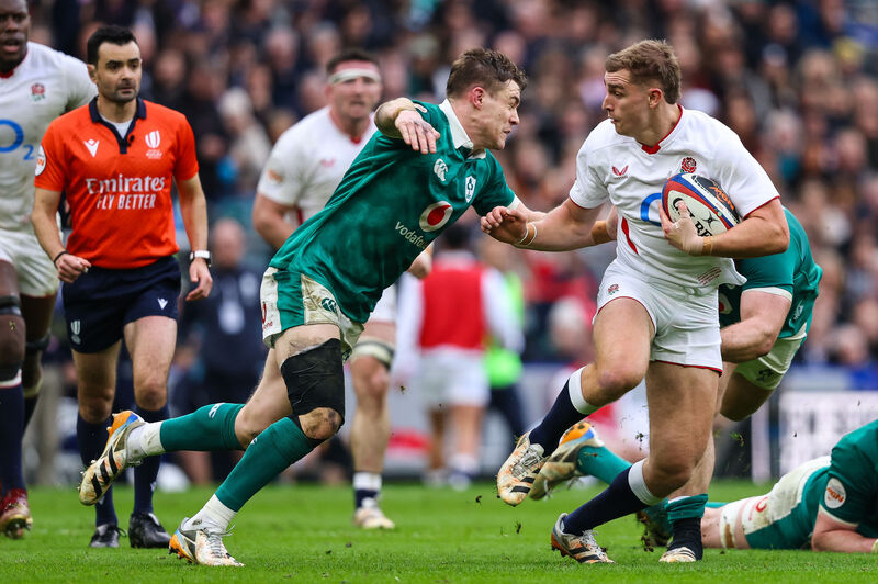England's Jack van Poortvliet is tackled by Garry Ringrose. Pic: Ben Brady/Inpho
