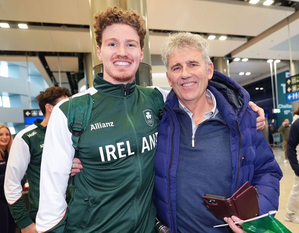 Ireland's Ben Lynch with his father Kevin during the Team Ireland homecoming at Dublin Airport.  results. Picture: Niall Carson/PA Wire.