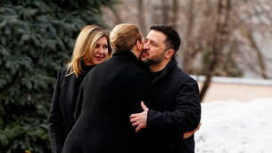 Denmark’s Prime Minister Mette Frederiksen, centre, is welcomed by Ukraine’s President Volodymyr Zelensky and his wife Olena Zelenska (Mads Claus Rasmussen/Ritzau Scanpix via AP)