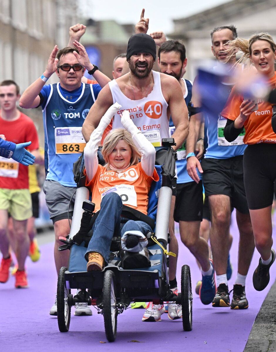 Actor Colin Farrell and Abbeyleix woman Emma Fogarty cross the finish line at the 2024 Dublin Marathon. Photo: Sportsfile
