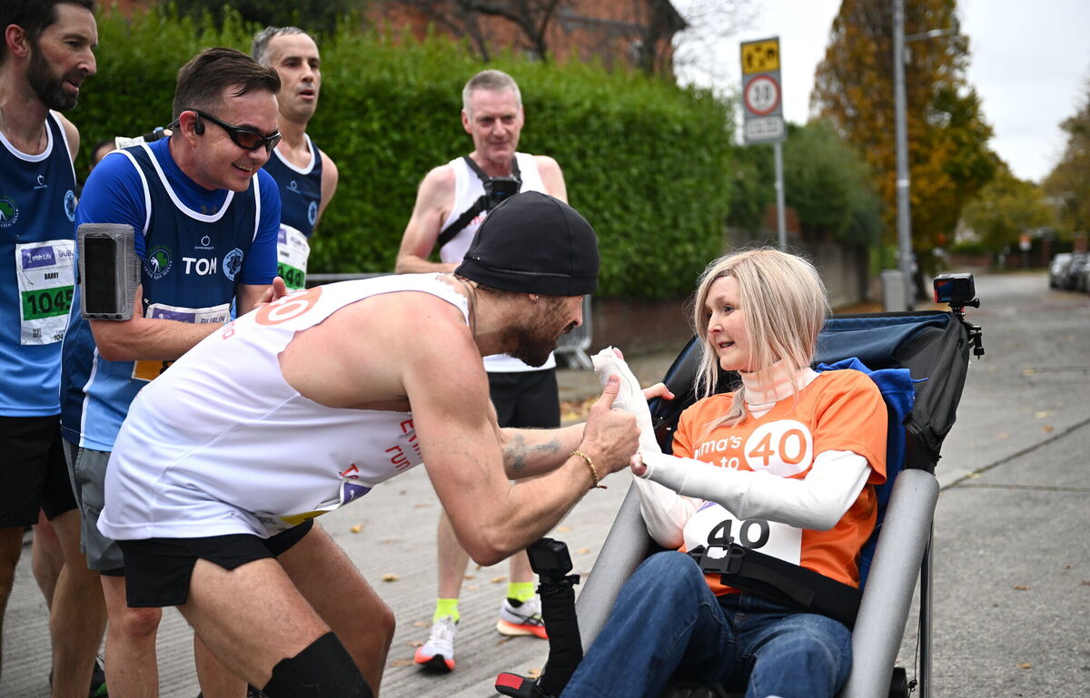 Actor Colin Farrell with Emma Fogarty during the 2024 Irish Life Dublin Marathon. Photo: Ramsey Cardy/Sportsfile