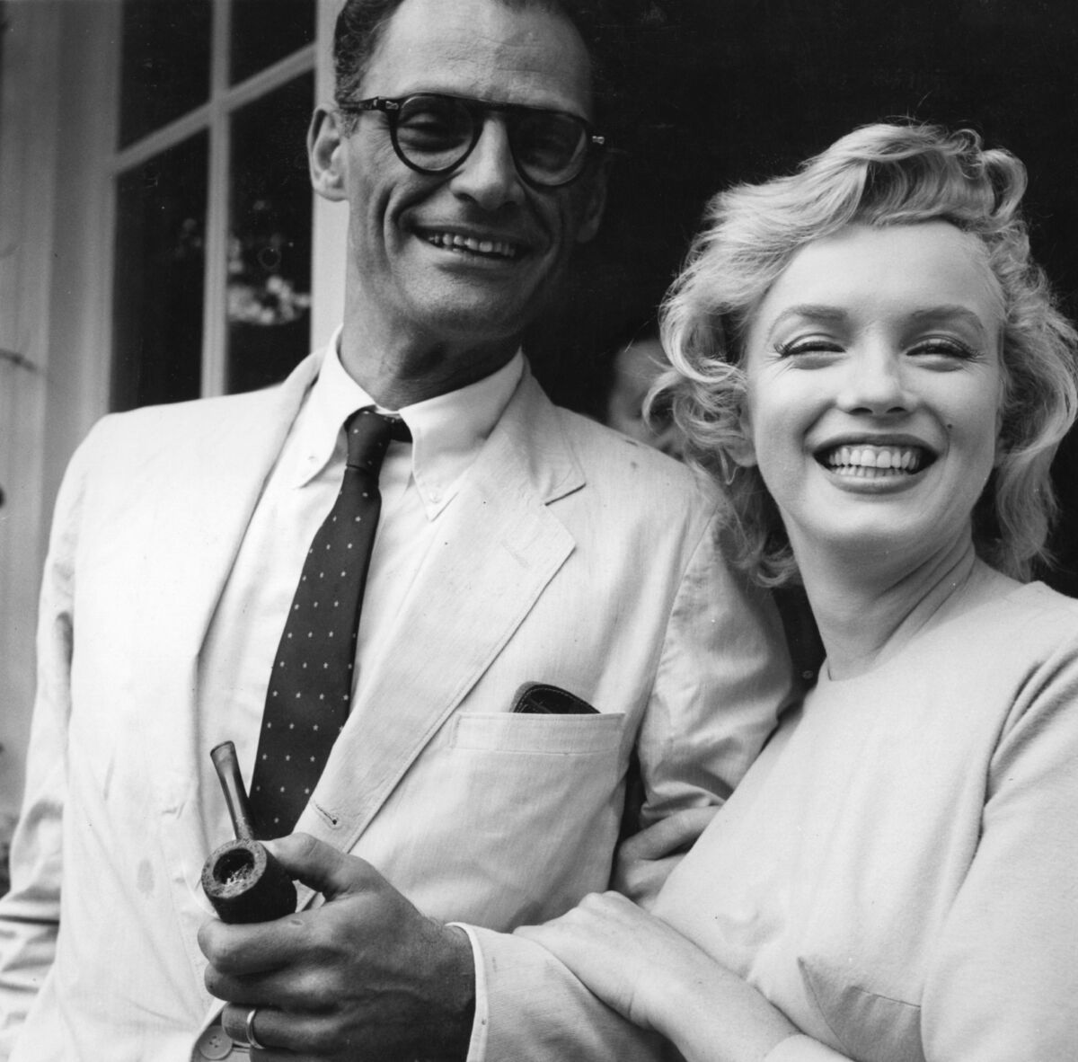 Marilyn Monroe outside her home in Englefield Green with her third husband Arthur Miller. Picture: Evening Standard/Getty Images