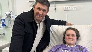 <p>Padraig Harrington visiting west Cork teenager Féile O'Sullivan in hospital. Picture: Padraig Harrington/X</p>