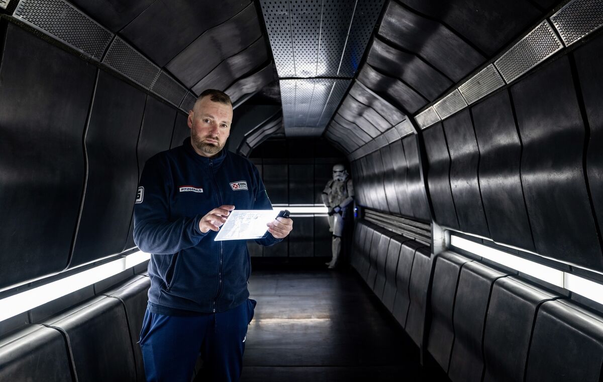 Michael Fitzgerald tests a lighting control pad he designed from everyday gadgets for use on the spaceship set he constructed near Killeagh. Picture: Chani Anderson