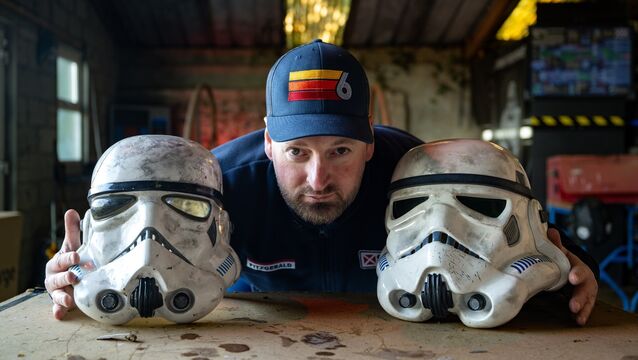 <p>Michael Fitzgerald poses between two battle-worn stormtrooper masks. Picture: Chani Anderson</p>