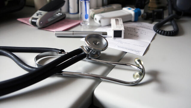 A doctor's desk at a general practitioner's surgery. UK.