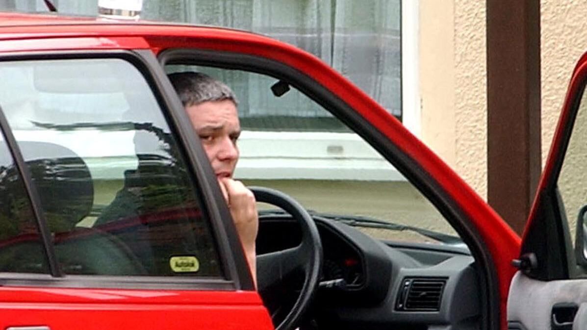 Ian Huntley sitting in his car outside his house near the college in Soham in 2002, during the period when police were looking for 10-year-old Holly Wells and Jessica Chapman. 
