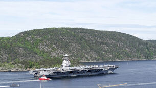 <p>The aircraft carrier USS Gerald R. Ford passes on its way to the Oslo Fjord, at Drobak, Norway, Wednesday, May 24, 2023. The ship is the world's largest warship and will be in port of Oslo for four days. (Terje Pedersen/NTB Scanpix via AP)</p>