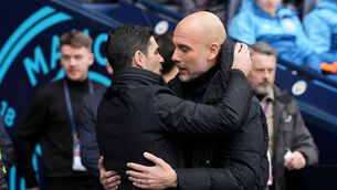 Pep Guardiola, right, has no advice for title-chasing Arsenal manager Mikel Arteta (Martin Rickett/PA)