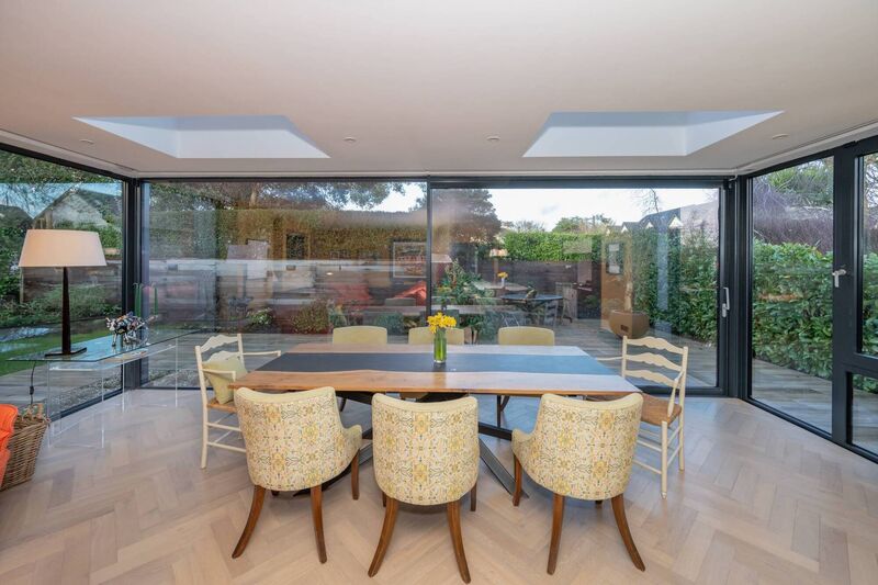 A wraparound glass extension blurs boundaries between inside and out A wraparound glass extension blurs boundaries between inside and out