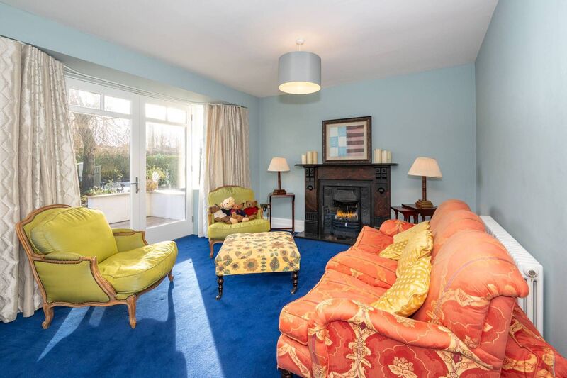 Graceful French doors open from the living room to a south facing front patio Graceful French doors open from the living room to a south facing front patio