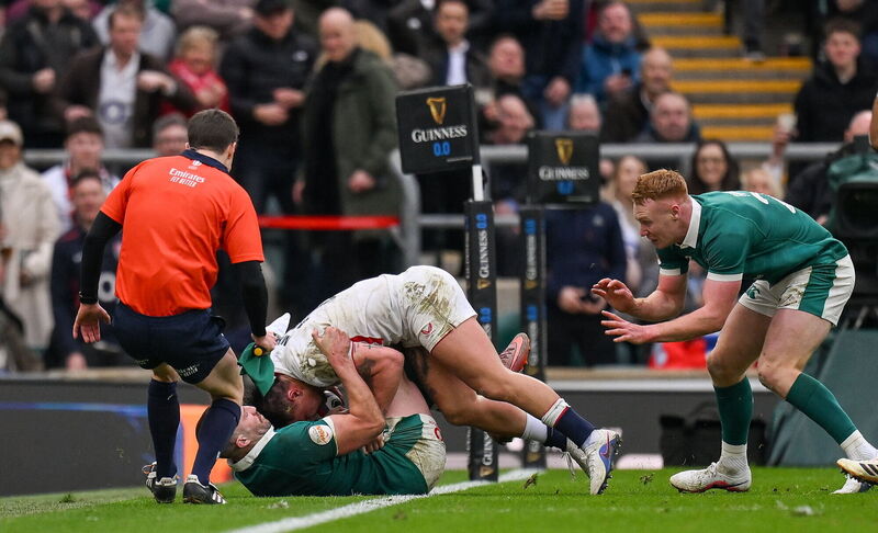 Stuart McCloskey drags England's Marcus Smith into touch during the Six Nations match at Twickenham. Pic: Brendan Moran/Sportsfile