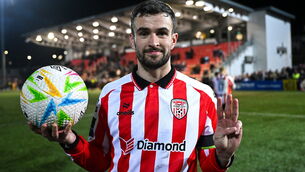 <p>Michael Duffy of Derry City with the match ball after scoring a hat-trick. Pic: Ramsey Cardy/Sportsfile</p>