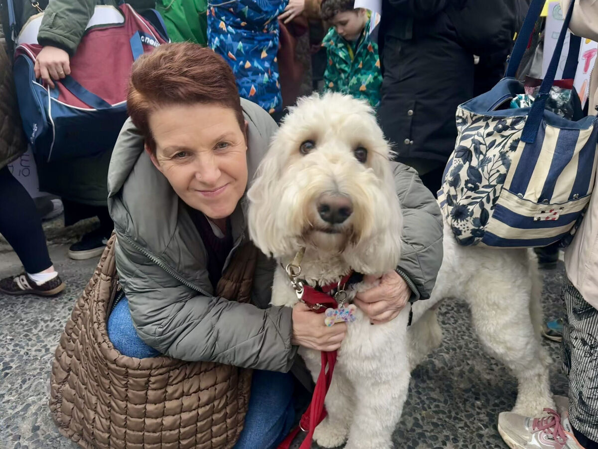 Michelle Adebisi and school service dog Diego from Bray joined the special needs assistants' demonstration outside Leinster House earlier this week. Picture: Bairbre Holmes/PA