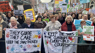 <p>Parents, special needs assistants (SNAs), and their supporters demonstrating outside Leinster House in Dublin on Wednesday. Picture: Bairbre Holmes/PA</p>