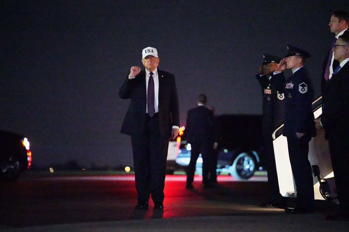 President Donald Trump holds up a fist after disembarking Air Force One at Palm Beach International Airport in West Palm Beach, Fla., Friday, Feb. 27, 2026. (AP Photo/Matt Rourke)