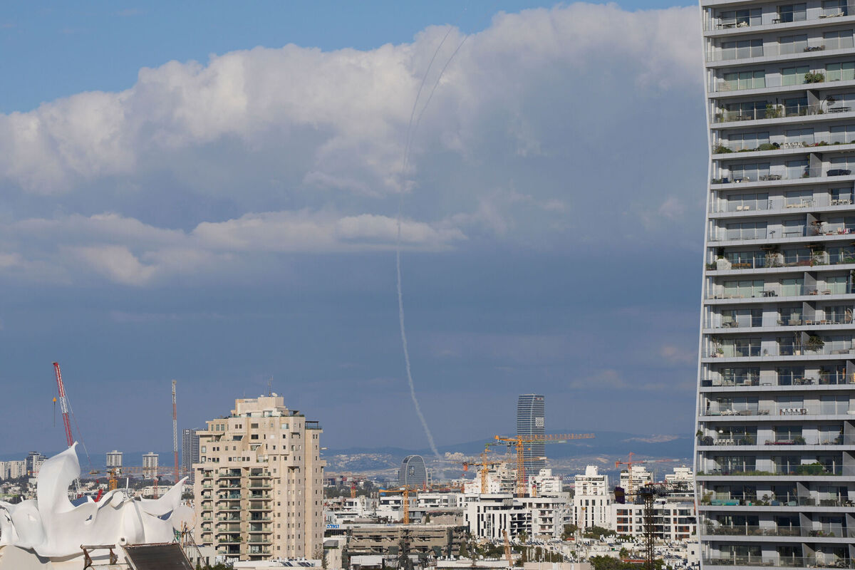 The trace of an air defense missile interception is seen over Tel Aviv, Israel, Saturday, Feb. 28, 2026. (AP Photo/Ohad Zwigenberg)