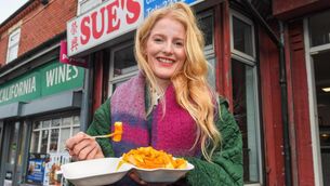 <p>Newly-elected Green MP for Gorton and Denton, Hannah Spencer, eats chips in curry sauce from a takeaway near her constituency office in Manchester. Picture: Andy Kelvin/PA Wire</p>