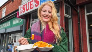 <p>Newly-elected Green MP for Gorton and Denton, Hannah Spencer, eats chips in curry sauce from a takeaway near her constituency office in Manchester. Picture: Andy Kelvin/PA Wire</p>