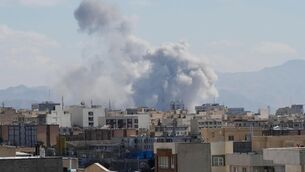 <p>Smoke rises up after an air strike in Tehran on  Sunday. A representative body for the oil and petrol industry in Ireland said there is "no indication"  that this weekend’s attacks by the US and Israel on Iran events will lead to dramatic or sustained increases in Irish pump prices.</p>