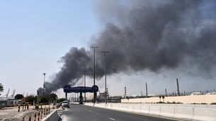 <p>A plume of smoke caused by an Iranian strike is seen in Dubai in the United Arab Emirates. Picture: Altaf Qadri/AP</p>