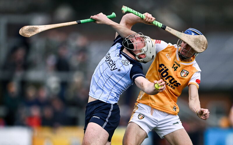 Andrew Dunphy of Dublin and James McNaughton of Antrim go up for the sliotar. Pic: Ben McShane/Sportsfile