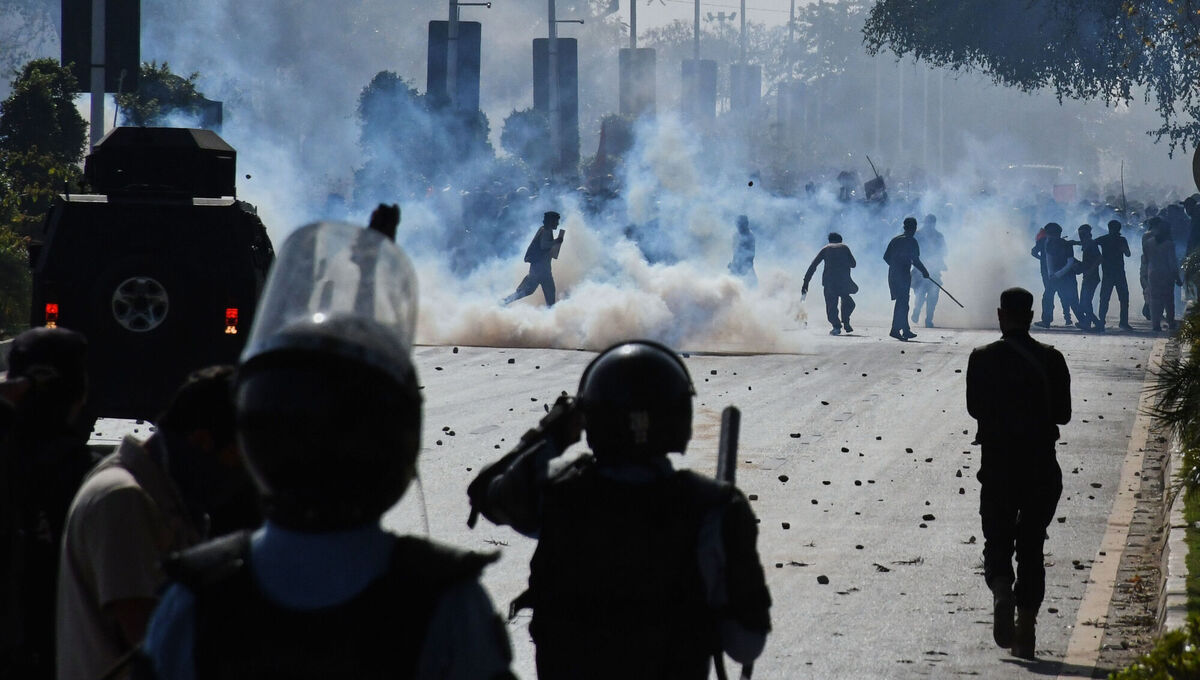 Police officers fire tear gas shells to disperse Shiite Muslims marching toward US embassy during a rally to condemn the killing of Iranian Supreme Leader Ayatollah Ali Khamenei, in Islamabad, Pakistan, on Sunday. Picture: MA Sheikh/AP Police officers fire tear gas shells to disperse Shiite Muslims marching toward US embassy during a rally to condemn the killing of Iranian Supreme Leader Ayatollah Ali Khamenei, in Islamabad, Pakistan, on Sunday. Picture: MA Sheikh/AP