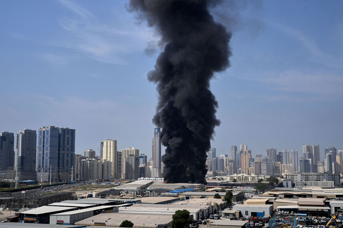A black plume of smoke rises from a warehouse at the industrial area of Sharjah City in the United Arab Emirates following reports of Iranian strikes in Dubai, United Arab Emirates, Sunday, March 1, 2026. Picture: AP Photo/Altaf Qadri