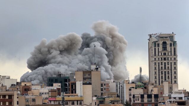 A plume of smoke rises after a strike in Tehran, Iran, on Monday (Mohsen Ganji/AP)