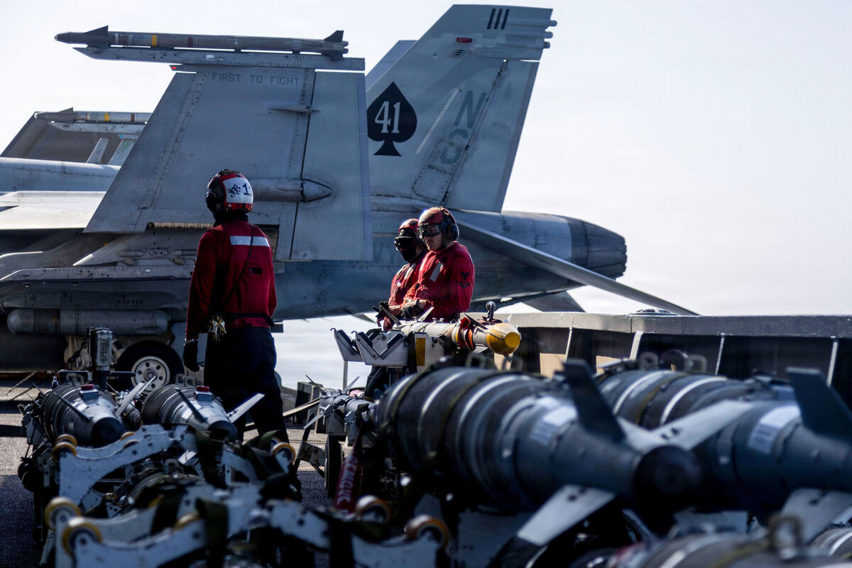 U.S. Central Command shows Navy sailors looking over ordnance on the flight deck of the USS Abraham Lincoln (CVN 72). (U.S. Navy via AP)