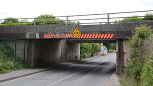 <p>Despite the installation of height-warning signs on approaches, lorry drivers are getting stuck under Bailick Bridge in Midleton. File picture: Denis Minihane</p>