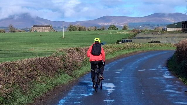 <p>Dan McCarthy approaching Cappoquin, Co Waterford with the Knockmealdown Mountains in the background. </p>