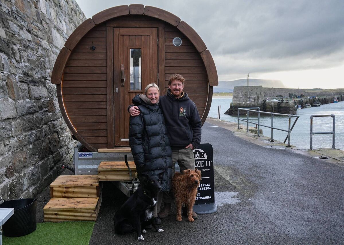 Megan Gayda and Cillian Ryan with their mobile sauna (@blazeitsauna) at Mullaghmore Pier in Co Sligo. 