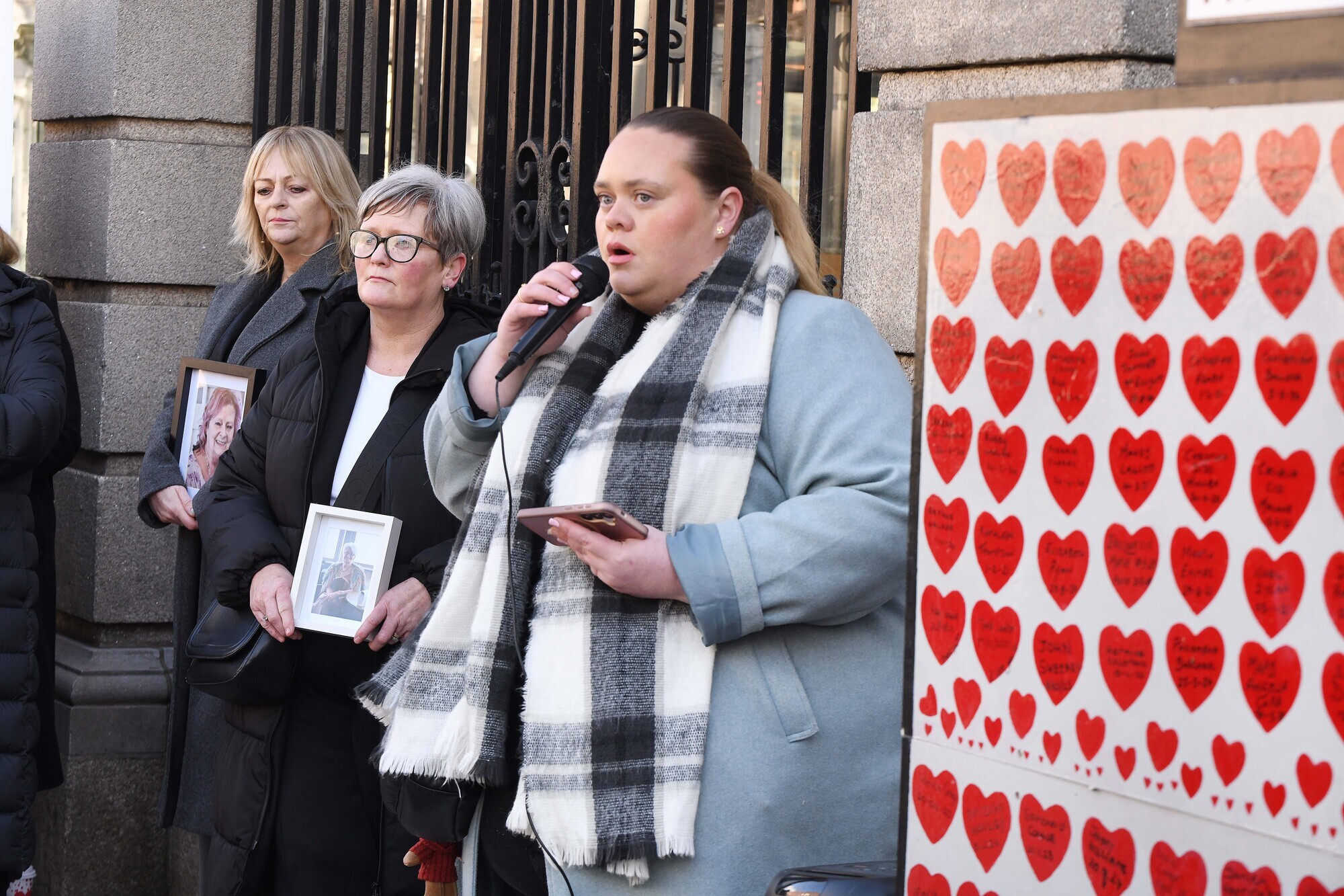  Allison McCarthy (centre) from Cork holding a framed photograph of her mother Alice Donovan, Lorraine Lamb (left) with a photograph of her mother Jean, and Maria Stynes (right) outside the Dail at a memorial event organised by Care Champions marking six years since nursing homes and disability centres first locked down for covid-19. Picture: Moya Nolan