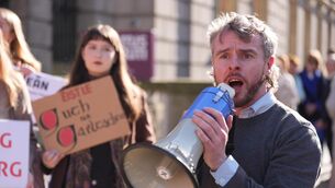 <p>National Gaeltacht housing campaigners took part in a protest outside Leinster House (Niall Carson/PA)</p>
